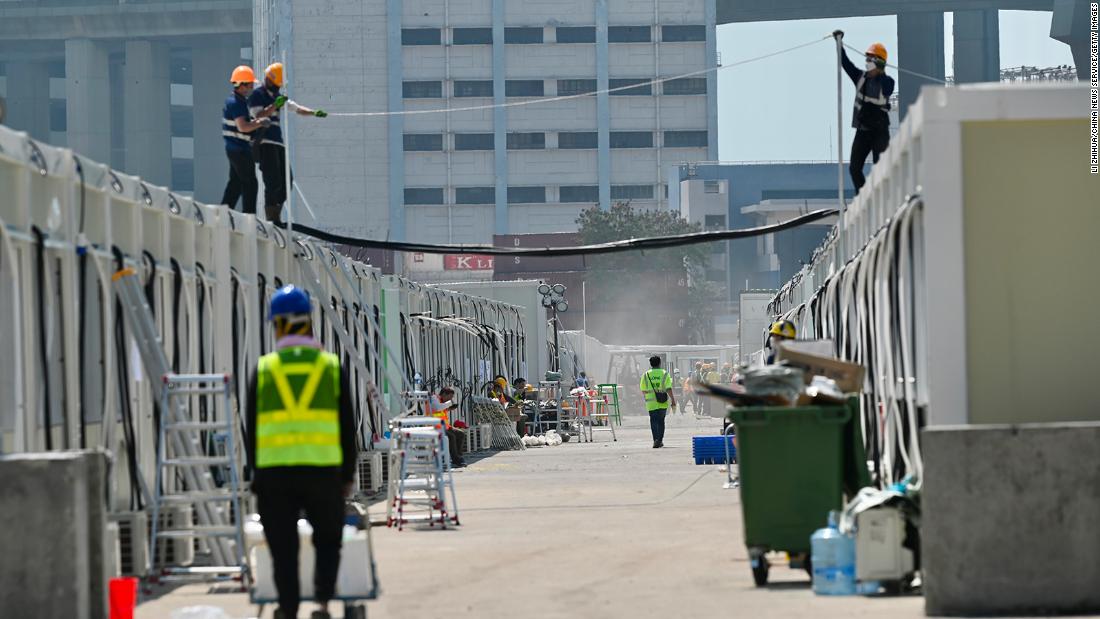 Workers build isolation units in Hong Kong on February 27, 2022.