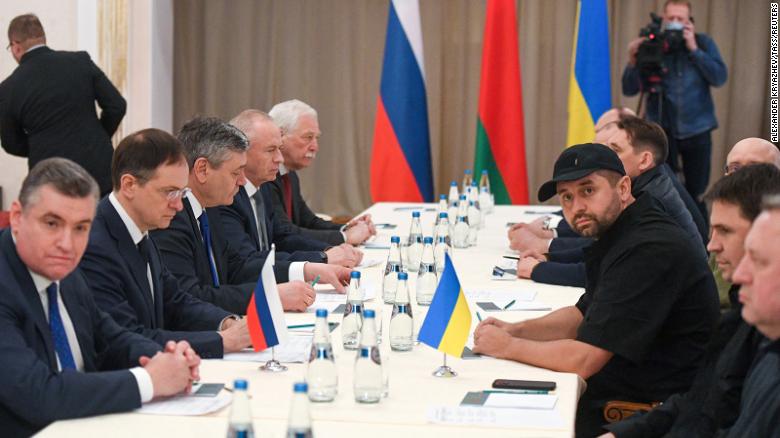 Russian officals, left, and Ukrainian officials, right, during talks on February 27 in the Gomel region of Belarus.