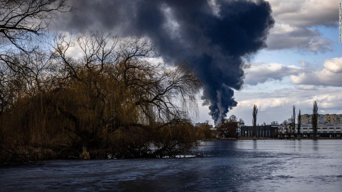 Smoke billows over the Ukrainian city of Vasylkiv, just outside Kyiv on Sunday, February 27. A fire at an oil storage area was seen raging at the Vasylkiv Air Base.