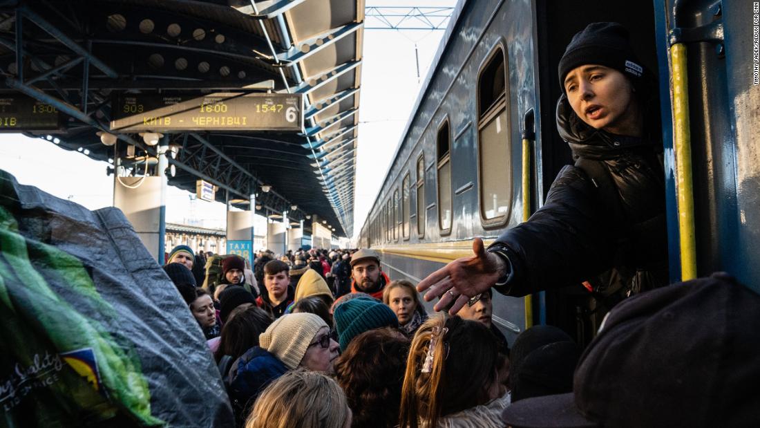 Passengers anxiously board trains in Kyiv before heading to destinations in the western part of the country on Monday, February 28.