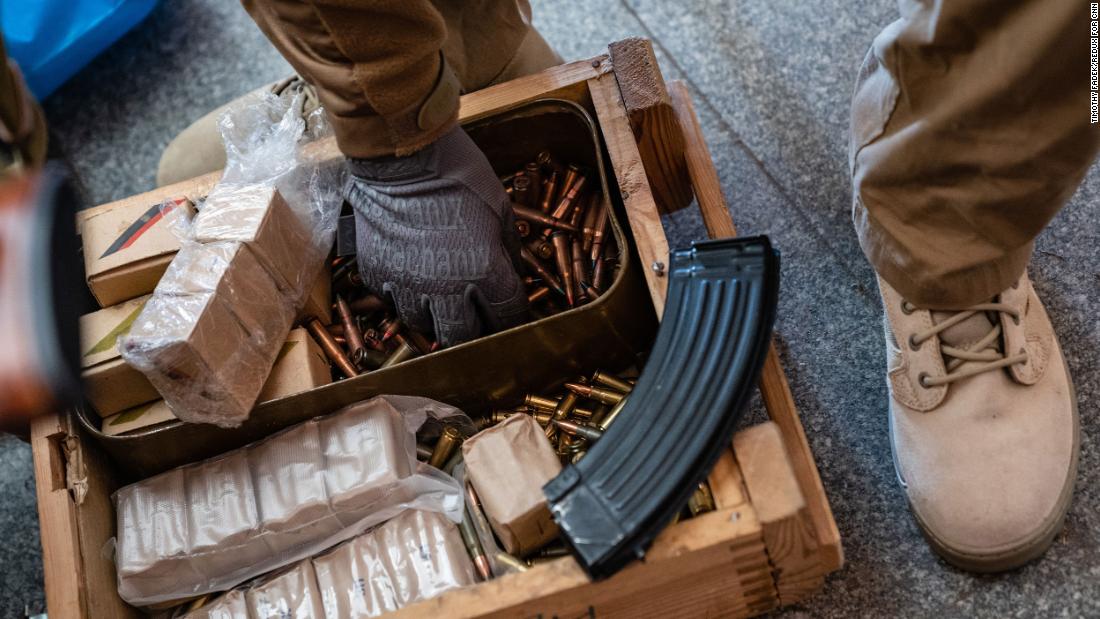 A member of the Territorial Defense Forces loads rifle magazines in Kyiv on February 28.