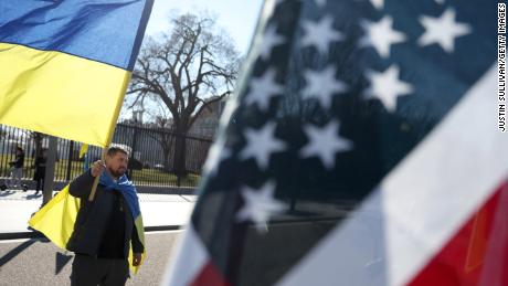 A protester holds a Ukrainian flag during a rally in front of the White House on February 28 in Washington, DC.
