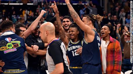 Ja Morant celebrates with his teammates after hitting a buzzer-beater against the San Antonio Spurs.