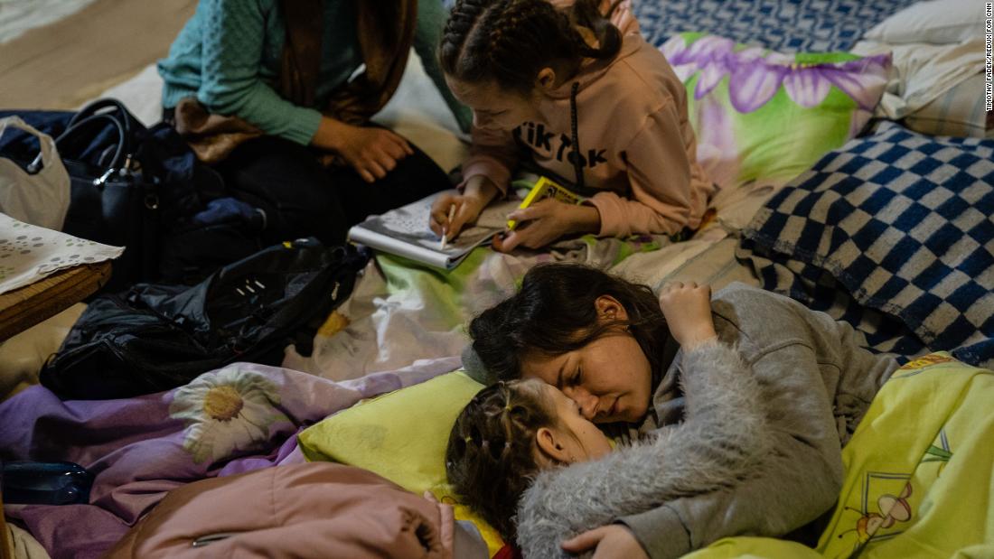 A woman named Helen comforts her 8-year-old daughter, Polina, in the bomb shelter of a Kyiv children's hospital on March 1. The girl was at the hospital being treated for encephalitis, or inflammation of the brain.
