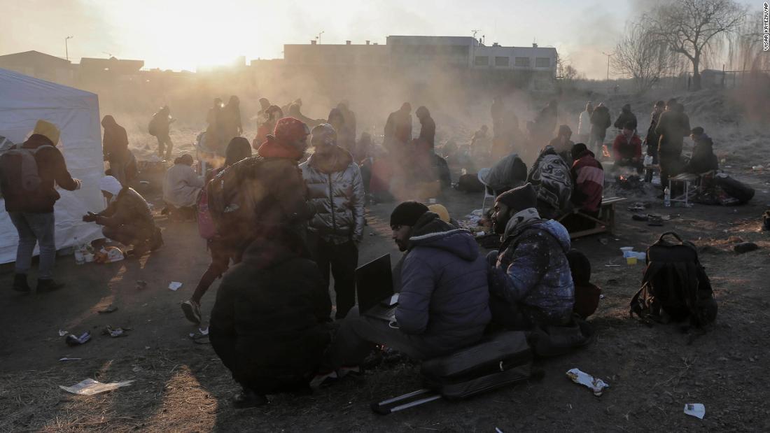 Ukrainian refugees try to stay warm at the Medyka border crossing in Poland on March 1.