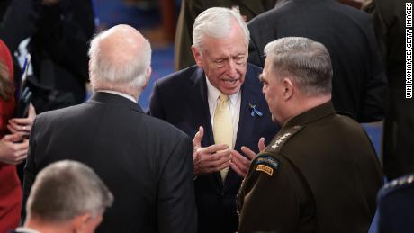 From left to right, Sen. Patrick Leahy, House Majority Leader Steny Hoyer, and Chairman of the Joint Chiefs of Staff Gen. Mark Milley talk while waiting for U.S. President Joe Biden&#39;s State of the Union address.