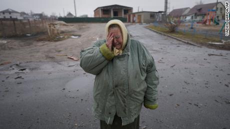 A Woman Cries Outside Houses Damaged By A Russian Airstrike, According To Locals, In Gorenka, Outside Ukraine'S Capital, Kyiv, On Wednesday.
