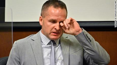 Former Louisville Police officer Brett Hankison wipes a tear as he testifies in court on Wednesday about the botched raid of Breonna Taylor's home.