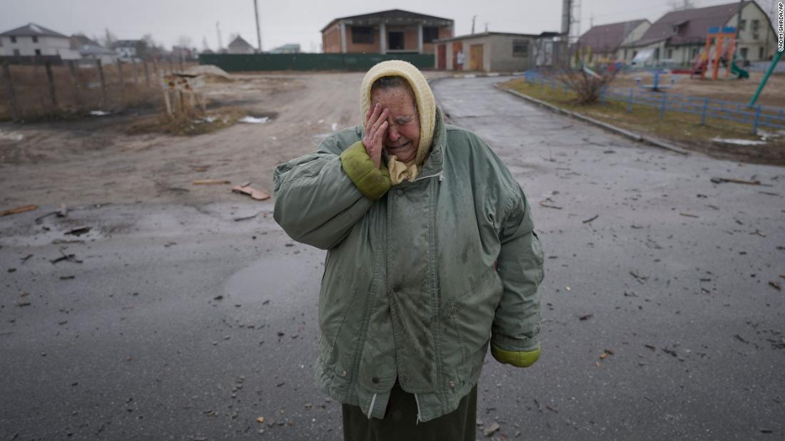 A woman cries March 2 in the street of a neighborhood that was damaged by airstrikes in Gorenka, Ukraine.