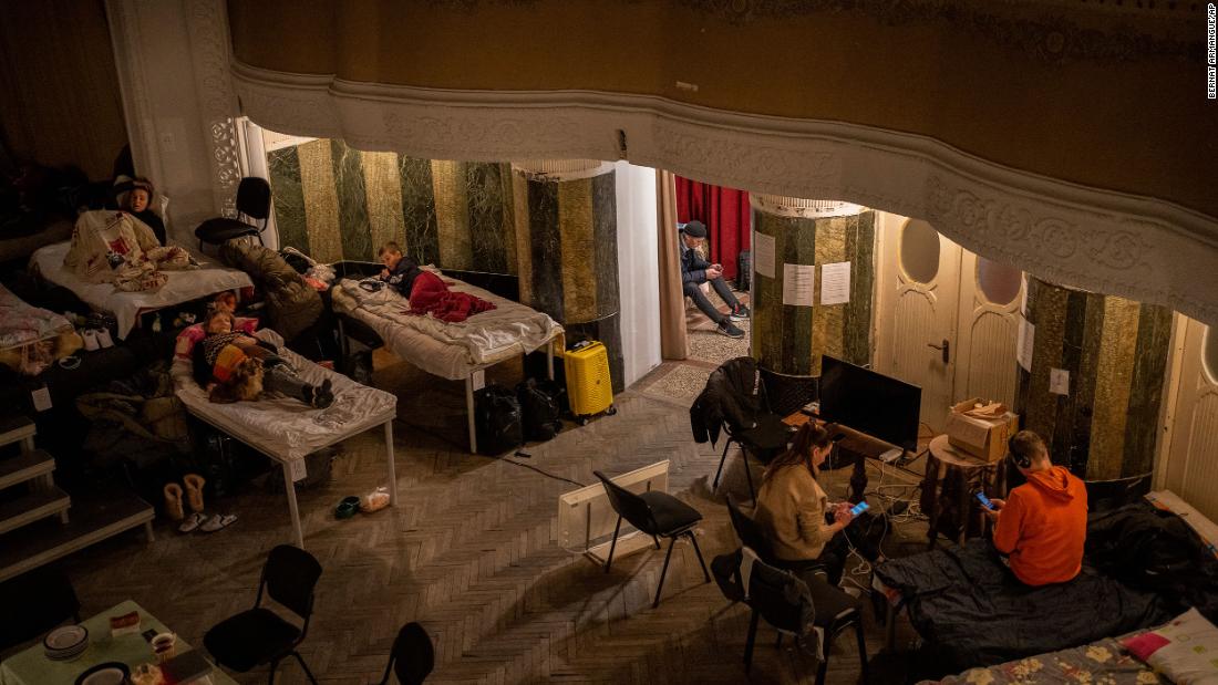 Displaced Ukrainians take shelter in an auditorium in Lviv on March 2.