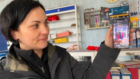 Yurko showing off pictures of her family. (Ivana Kottasova/CNN)