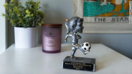 A soccer trophy sits on Kennedy Stonum's nightstand.  