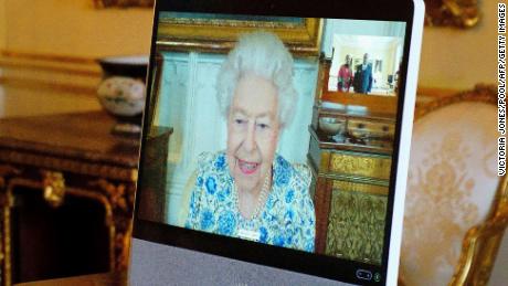 The Queen appears on a screen via video link from Windsor Castle, during a virtual audience to receive Malawi's High Commissioner, Dr Thomas Bisika (not pictured), at Buckingham Palace in London on Thursday.