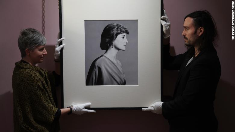 Conservators handle David Bailey&#39;s portrait of Diana.