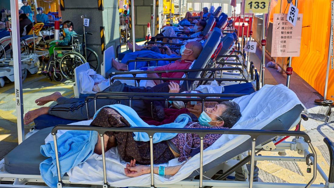 Covid-19 patients seen laying on beds outside the Caritas Medical Center in Hong Kong. 