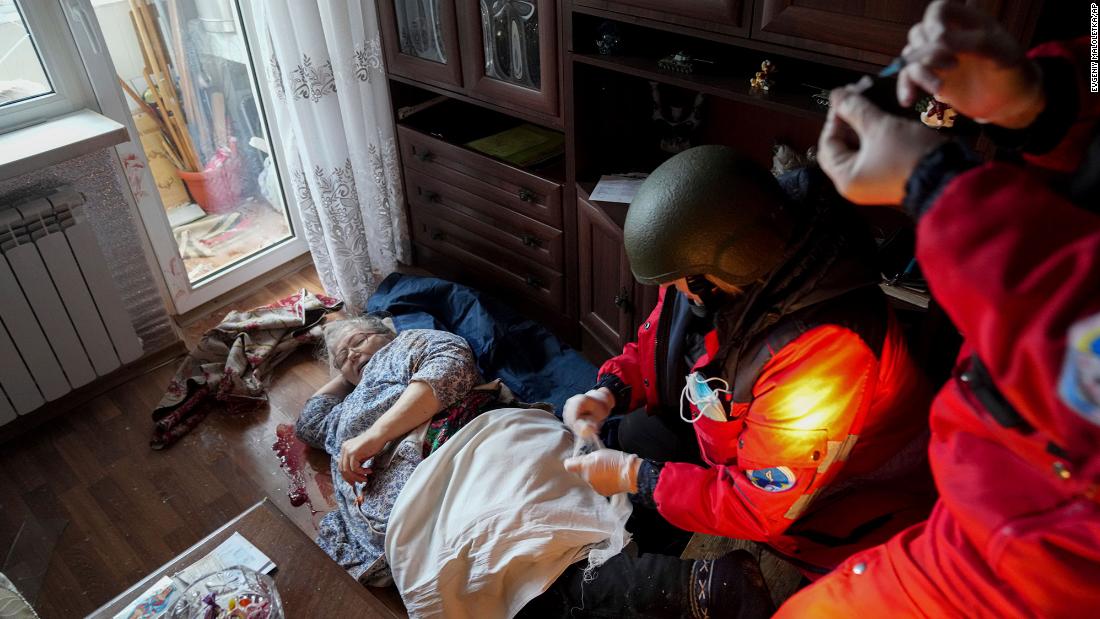 Paramedics treat an elderly woman wounded by shelling before transferring her to a hospital in Mariupol, Ukraine, on March 2.