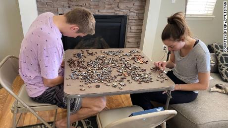 Stutzman says she loved watching Palmer and Anabelle & # 39 ;s relationship grow during the pandemic.  She snapped this photo of the couple working on a puzzle together.