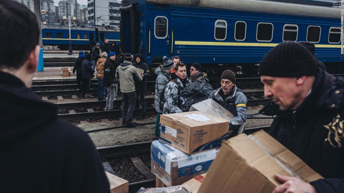 People form a human chain to transfer supplies into Kyiv on March 3.