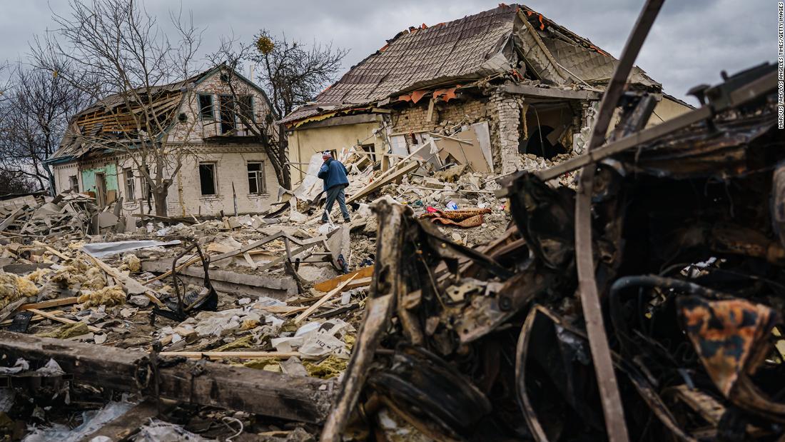 Local residents help clear the rubble of a home that was destroyed by a suspected Russian airstrike in Markhalivka, Ukraine, on Saturday, March 5.