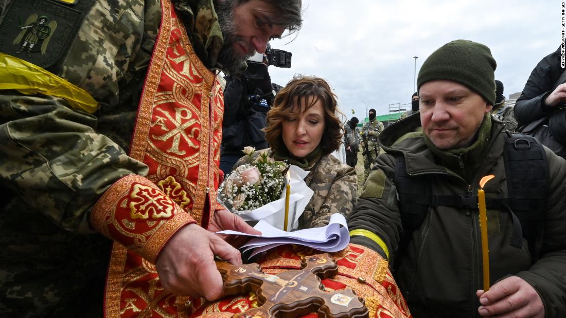 Valery and Lesya, members of Ukraine&#39;s Territorial Defense Forces, get married on the outskirts of Kyiv on March 6.