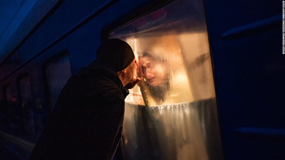 George Keburia says goodbye to his wife and children as they board a train in Odessa on March 5. They were heading to Lviv.