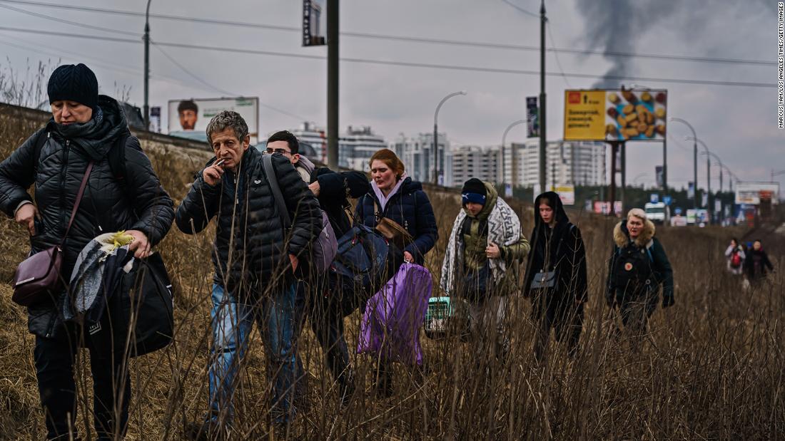 Local residents evacuate Irpin as Russian forces continued to bombard the town with artillery on March 6.