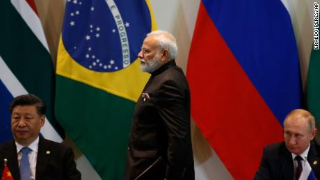 India&#39;s Prime Minister Narendra Modi, flanked China&#39;s President Xi Jinping, left, and Russia&#39;s President Vladimir Putin, at a BRICS Leaders Dialogue in Brazil in 2019. 