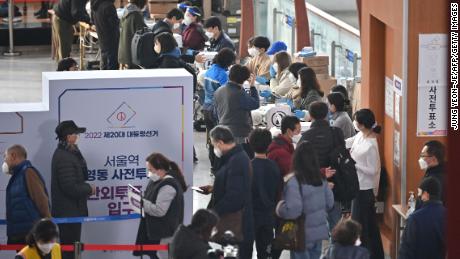 People cast their ballots in South Korea's early presidential election at a polling station in Seoul on March 4.
