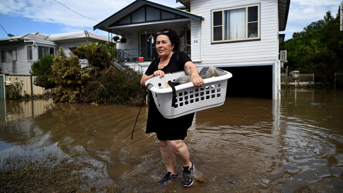 Patria Powell salvages items from her mother&#39;s flooded home in Woodburn, Australia, on March 7.