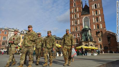 US soldiers from the 82nd Airborne Division visit the main square in Krakow, Poland, March 8, 2022. 