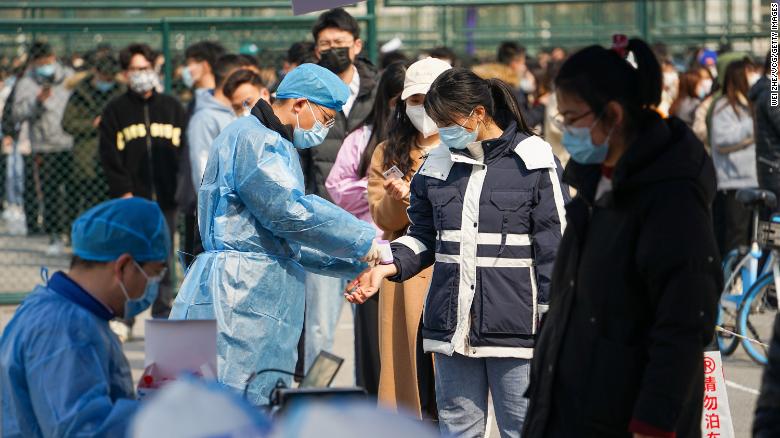 Students line up for Covid-19 testing at Qingdao Agricultural University on March 7 in China&#39;s Qingdao city.