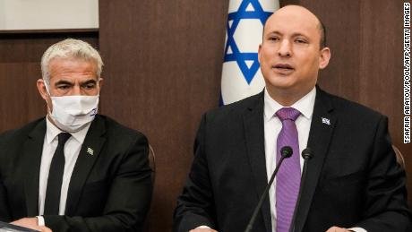 (R to L) Israeli Prime Minister Naftali Bennett chairs the weekly cabinet meeting, with Foreign Minister Yair Lapid, at the prime minister&#39;s office in Jerusalem on February 20.