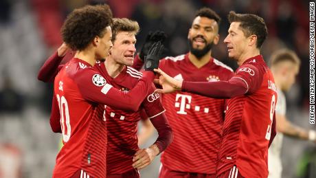 Leroy Sané celebrates Bayern's seventh goal of the evening with his teammates.
