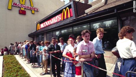 Russians are waiting in line outside McDonald's fast food restaurant in Moscow in 1990. 