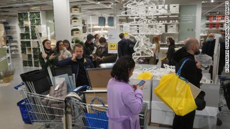 Shoppers will wait in line to pay for the purchase at the IKEA store in Moscow on March 3, 2022.