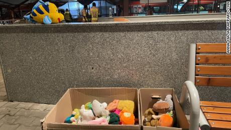 Carboard boxes filled with toys and stuffed animals await new owners.
