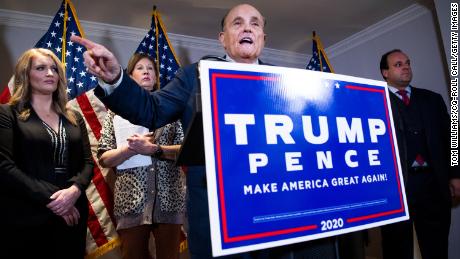 In this November 19, 2020, file photo, Rudy Giuliani conducts a news conference at the Republican National Committee on lawsuits regarding the outcome of the presidential election. 