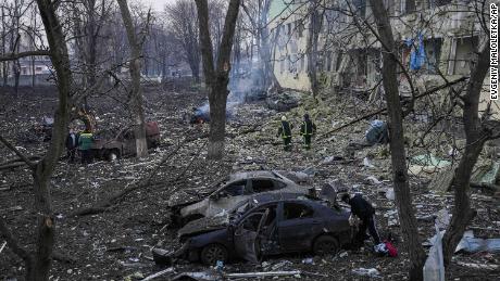 Ukrainian emergency employees work at the side of the damaged by shelling maternity hospital in Mariupol, Ukraine, Wednesday, March 9, 2022. A Russian attack has severely damaged a maternity hospital in the besieged port city of Mariupol, Ukrainian officials say. (AP Photo/Evgeniy Maloletka)