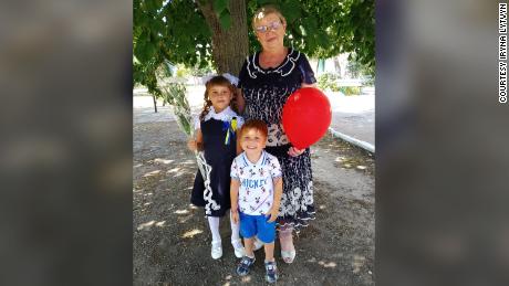Iryna Lytvyn&#39;s mother -- who she has lost contact with in a besieged Ukrainian city -- with her grandchildren before Moscow&#39;s brutal invasion ripped the family apart.