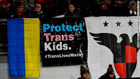 Feb 26, 2022; Washington, District of Columbia, USA; Fans fly the flag of Ukraine and a flag stating &quot;Protect Trans Kids&quot; in the second half between the D.C. United and the Charlotte FC at Audi Field. (Photo by Brad Mills-USA TODAY Sports)