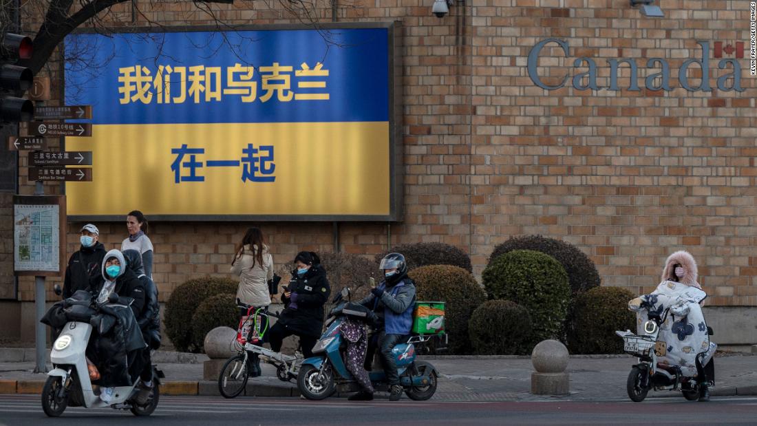 A large Ukrainian flag with the slogan &quot;We Stand With Ukraine&quot; written on it in Chinese characters is seen on the outside wall of the Canadian Embassy on March 1, 2022 in Beijing, China. 
