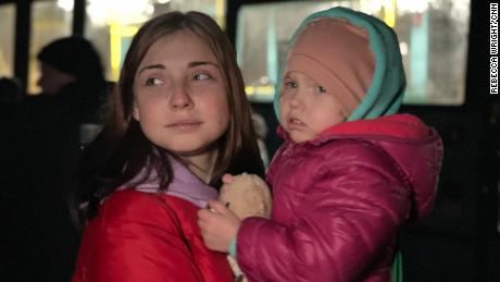 Krystina Ponomaryova, 21, and her two-year-old daughter Angelina after getting off the bus that brought them to safety. 