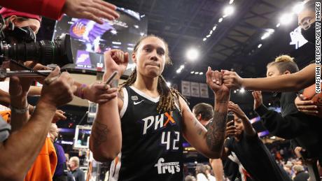 Brittney Griner #42 of the Phoenix Mercury celebrates with fans following Game Two of the 2021 WNBA Finals at Footprint Center on October 13, 2021 in Phoenix, Arizona. The Mercury defeated the Sky 91-86 in overtime.