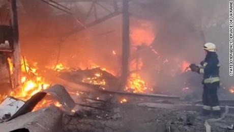 Emergency personnel put out a fire in Dnipro in central Ukraine.