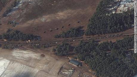 A satellite image taken near Berestyanka, northwest of Kyiv, appears to show resupply trucks and a probable multiple rocket launch deployment, according to Maxar Technologies.