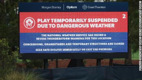 A leaderboard reads indicated the suspension of play during the first round of the Players Championship.