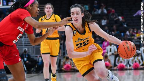 Caitlin Clark #22 of the Iowa Hawkeyes drives in the basket against MiCole Cayton #5 of the Nebraska Cornhuskers during the first half of a Women's Big Ten Tournament Semifinals game at Gainbridge Fieldhouse on March 05, 2022 in Indianapolis, Indiana.