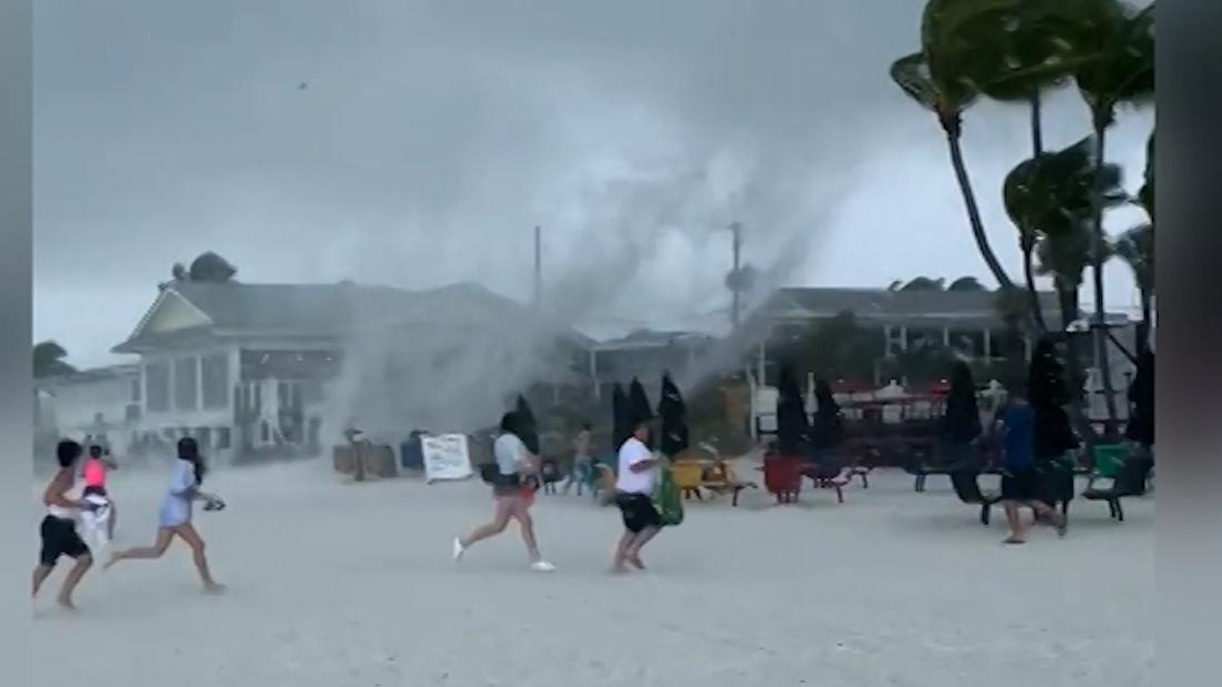 See waterspout fly across Florida beach