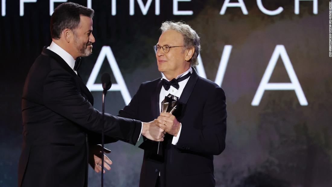 Talk-show host Jimmy Kimmel presents Billy Crystal with a lifetime achievement award.