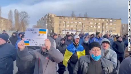 People protest the abduction of Mayor Ivan Fedorov, outside the Melitopol regional administration building, after he was reportedly taken away by Russian forces during their ongoing invasion, in Melitopol, Ukraine on March 12.